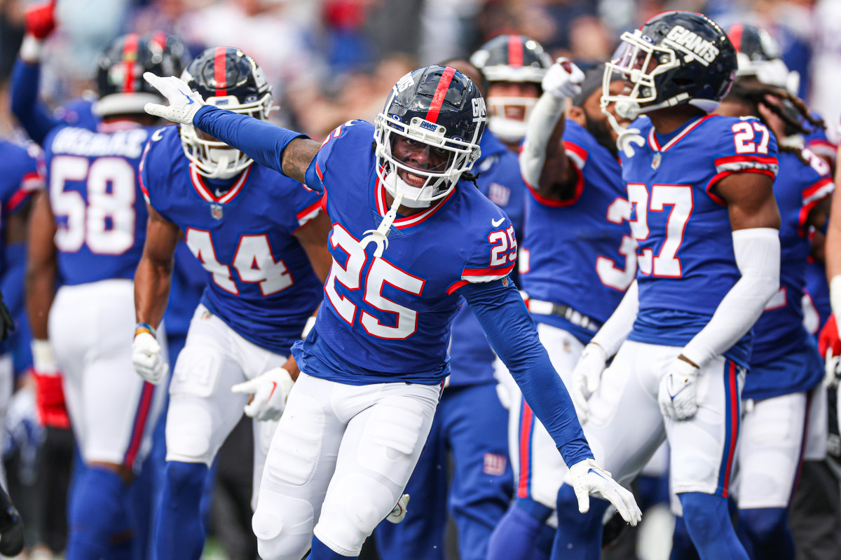 Oct 22, 2023; East Rutherford, New Jersey, USA; New York Giants cornerback Deonte Banks (25) celebrates after an interception against the Washington Commanders during the first half at MetLife Stadium.